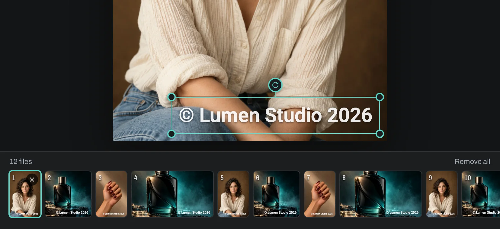 The batch strip with portrait, square and wide photos all wearing the same watermark